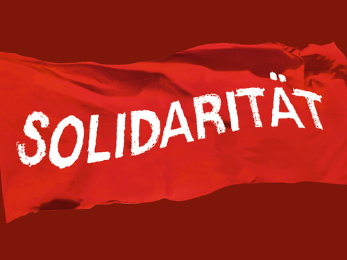 Grafik zur 100 Jahre Kampagne zeigt eine Rote Fahne mit der Auschrift »Solidarität«